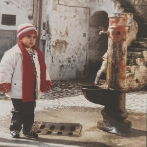 Me as a child standing in the Sassi near my family's cellar in Matera